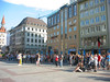 ancat > Masses of tourists stand to watch the Glockenspeil in action.  One of the main attractions in Munich.