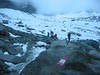 ancat > Looking back up on the descent down the valley back to the car.  The red and white markings identify all tracks of intermediate grade.  Blue and white markings identify tracks that are supposedly harder.